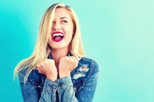 happy young woman on a blue background